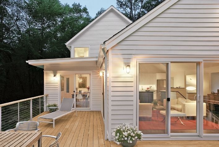 Exterior shot of Tree House Red Diamond Achiever residence featuring a straight, closed Elevate Sliding Patio Door